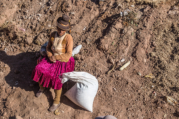 Woman Waiting with a Bag